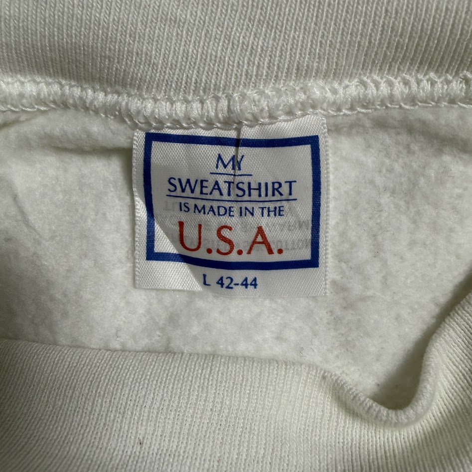 MY SWEATSHIRT IS MADE IN THE U.S.A. L 42-44と書かれたヴィンテージスウェットのタグ
